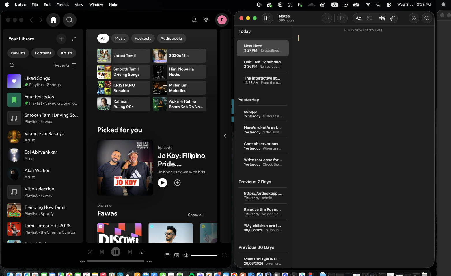 Spotify and Notes tiled side by side on the main display